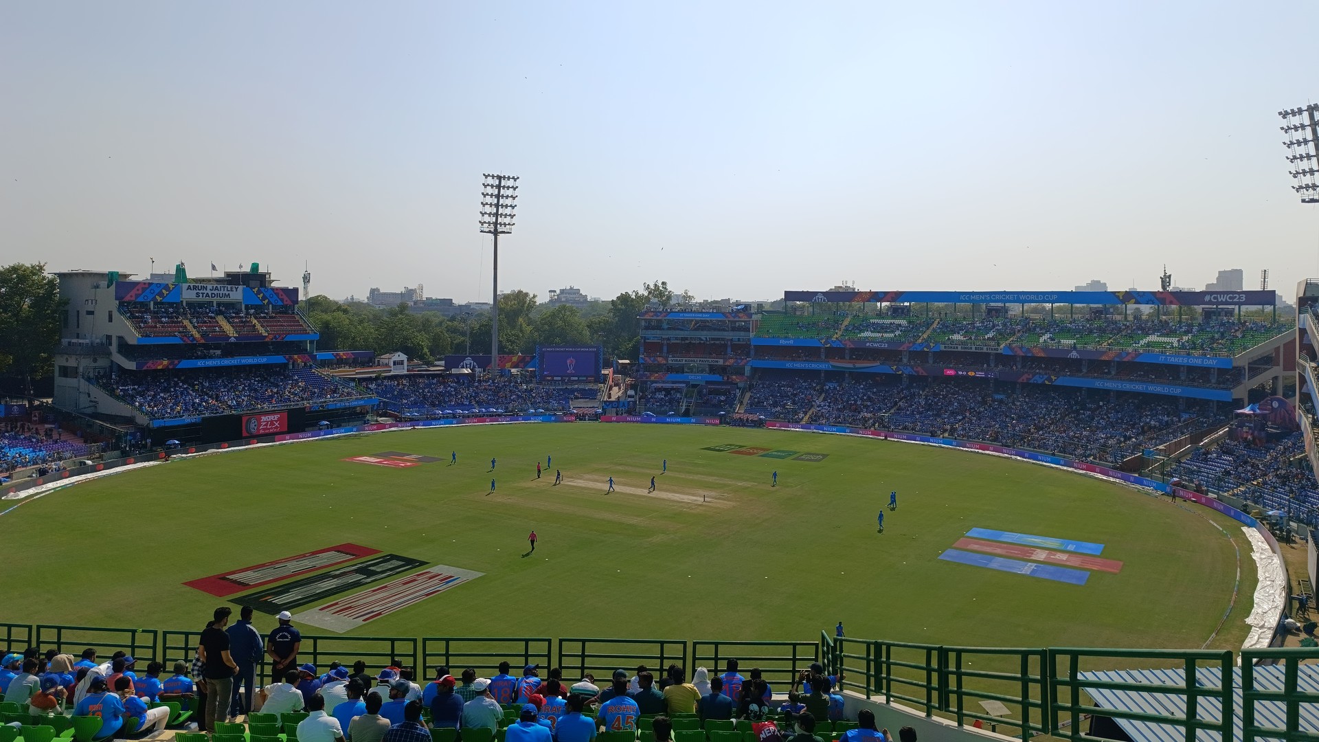 Packed crowd watches an India vs Afghanistan cricket match at Arun Jaitley Stadium in Delhi, with the stadium's name visible on the stand