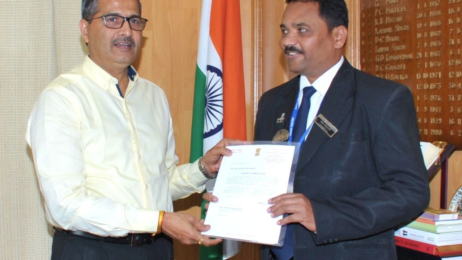 A railway employee being honoured with a letter of appreciation in the Railway Board chairman's office in New Delhi, file photo, railway staff are among the central government employees covered by Dearness Allowance