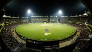 MA Chidambaram Stadium in Chennai lit up at night for a Chennai Super Kings home match, with the stands packed in yellow