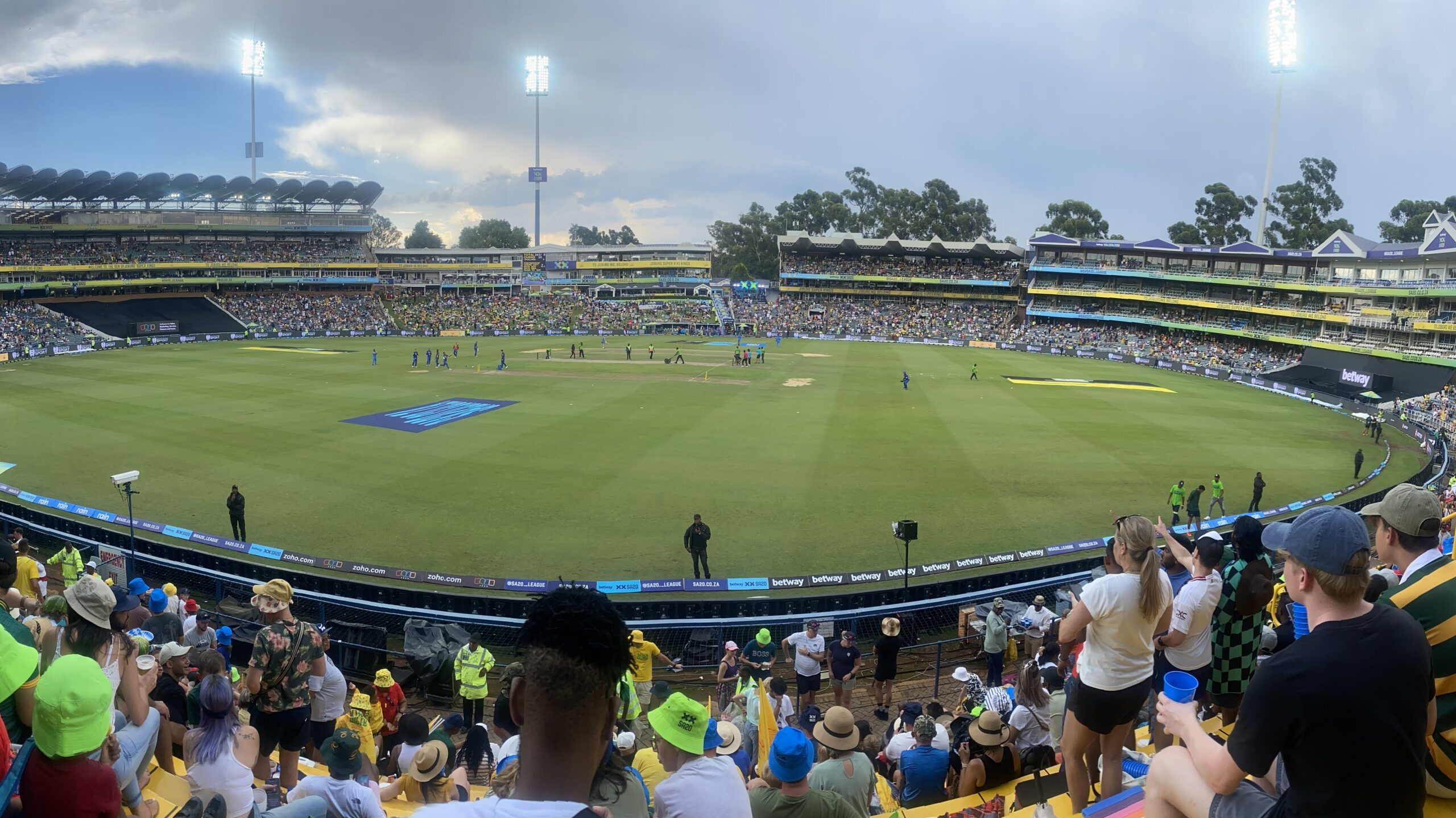 Packed stands and crowd at Wanderers Stadium in Johannesburg during an evening cricket match, venue of the 2027 Cricket World Cup final